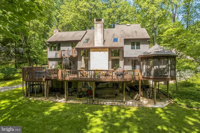 113 Sparrow Hawk Ln, Chadds Ford, PA 19317 - back of house featuring a sunroom, stairway, a wooden deck, and a yard