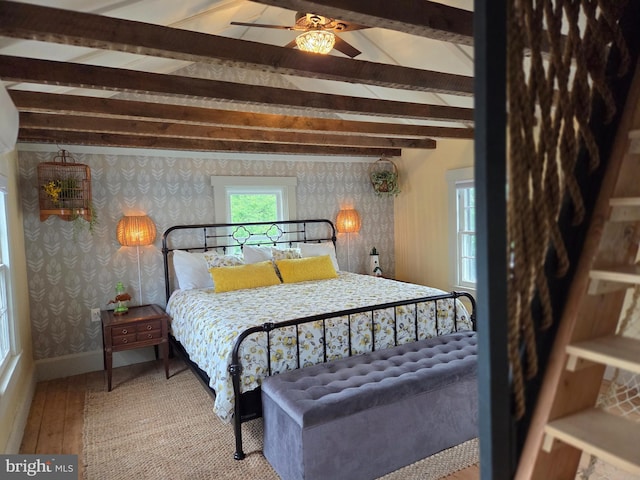 314 Bohemia Ave, Chesapeake City, MD 21915 - bedroom with wallpapered walls, beam ceiling, wood-type flooring, and baseboards
