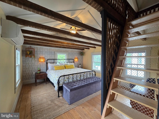 314 Bohemia Ave, Chesapeake City, MD 21915 - bedroom featuring wallpapered walls, a wall mounted AC, hardwood / wood-style flooring, and baseboards