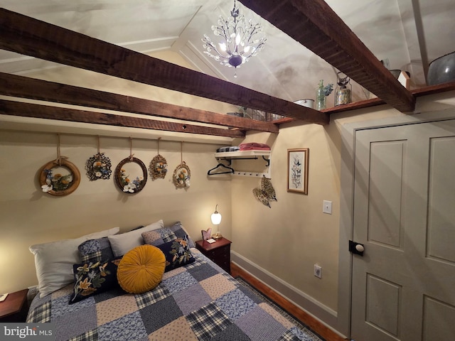 314 Bohemia Ave, Chesapeake City, MD 21915 - bedroom featuring baseboards, a chandelier, and wood finished floors