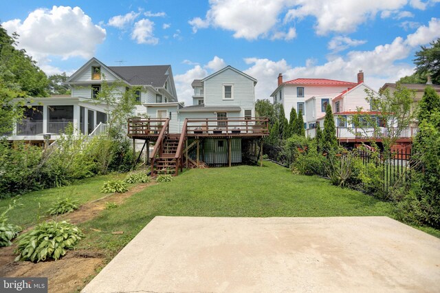 314 Bohemia Ave, Chesapeake City, MD 21915 - rear view of house featuring a wooden deck, stairway, a patio, and a sunroom