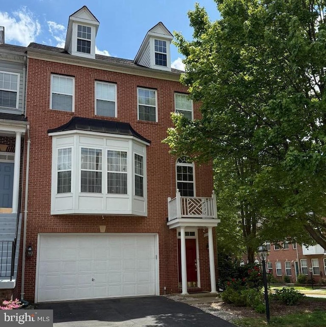 8859 Modano Pl, Fairfax, VA 22031 - multi unit property featuring driveway, brick siding, and a garage