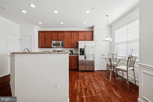 2529 Pascal Pl, Herndon, VA 20171 - kitchen with appliances with stainless steel finishes, dark wood-style floors, recessed lighting, hanging light fixtures, and light stone counters