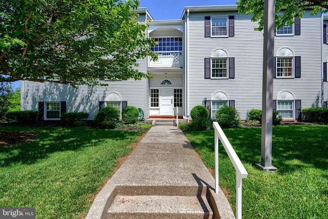 1 Brooking Ct Unit 202, Lutherville Timonium, MD 21093 - view of front facade with a balcony and a front yard