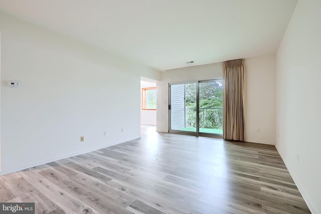 1 Brooking Ct Unit 202, Lutherville Timonium, MD 21093 - spare room with light wood-type flooring and baseboards