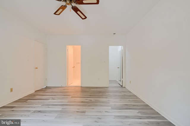 1 Brooking Ct Unit 202, Lutherville Timonium, MD 21093 - spare room featuring a ceiling fan, light wood-type flooring, and baseboards