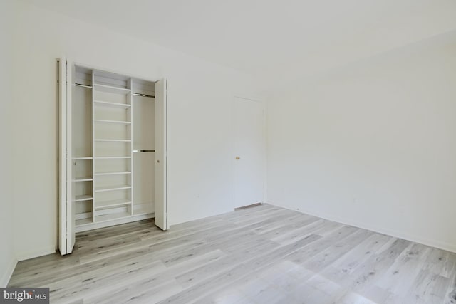 1 Brooking Ct Unit 202, Lutherville Timonium, MD 21093 - unfurnished bedroom featuring light wood-type flooring and a closet