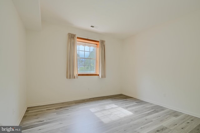 1 Brooking Ct Unit 202, Lutherville Timonium, MD 21093 - spare room with light wood finished floors and baseboards