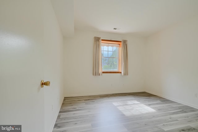 1 Brooking Ct Unit 202, Lutherville Timonium, MD 21093 - empty room with wood finished floors and baseboards