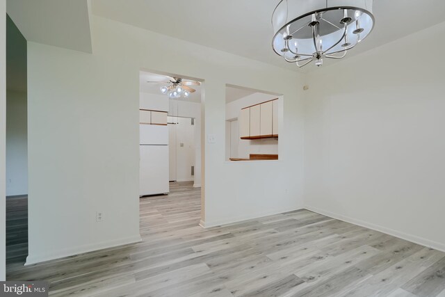 1 Brooking Ct Unit 202, Lutherville Timonium, MD 21093 - unfurnished dining area with light wood finished floors, a chandelier, a ceiling fan, and baseboards