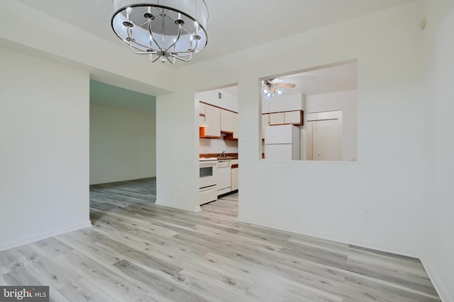 1 Brooking Ct Unit 202, Lutherville Timonium, MD 21093 - unfurnished dining area featuring light wood-style floors, a chandelier, a ceiling fan, and baseboards