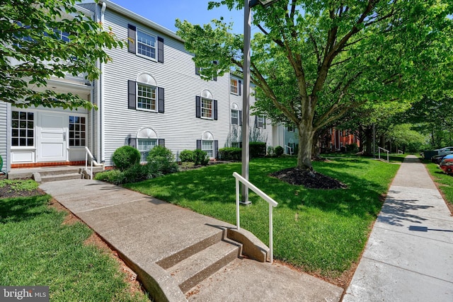 1 Brooking Ct Unit 202, Lutherville Timonium, MD 21093 - view of front facade featuring entry steps and a front lawn