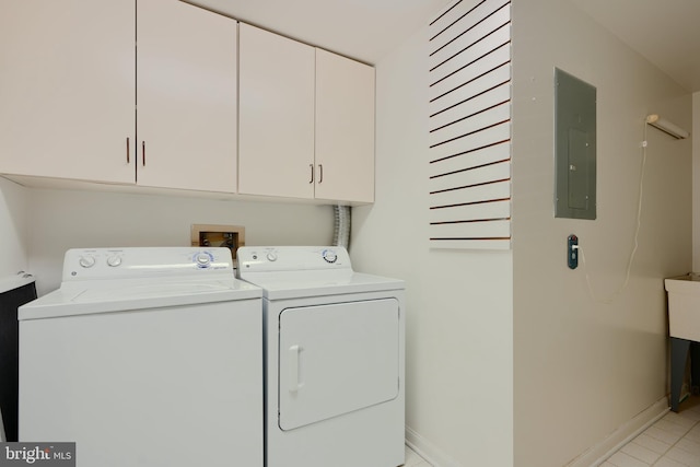 1 Brooking Ct Unit 202, Lutherville Timonium, MD 21093 - laundry area with cabinet space, washing machine and clothes dryer, baseboards, and electric panel