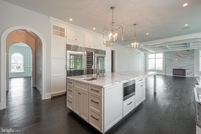1337 Carolannes Way Unit B6, West Chester, PA 19382 - kitchen featuring a sink, white cabinets, dark wood-style flooring, recessed lighting, and a chandelier
