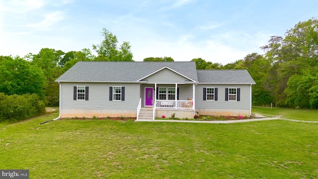 ranch-style house featuring covered porch, a front yard, and a shingled roof