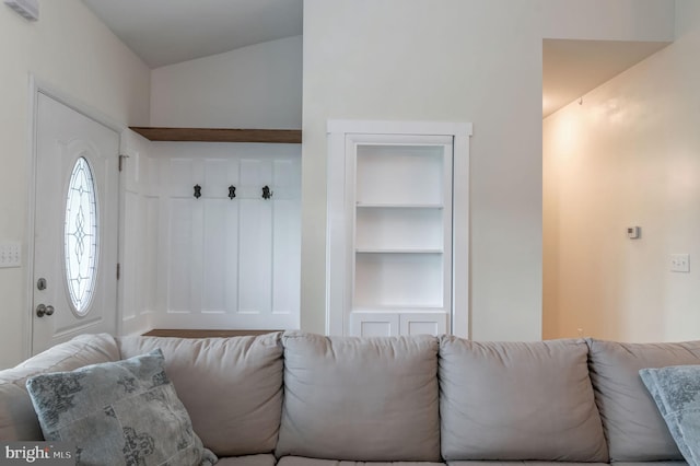 mudroom featuring built in shelves