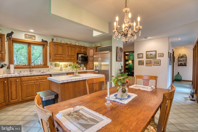 3012 Duncan Rd, White Hall, MD 21161 - dining space featuring light tile patterned flooring and a chandelier