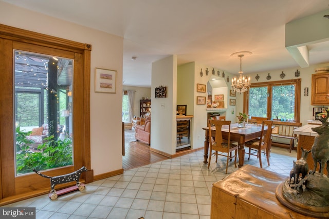 3012 Duncan Rd, White Hall, MD 21161 - dining room with a chandelier, baseboards, and light tile patterned floors
