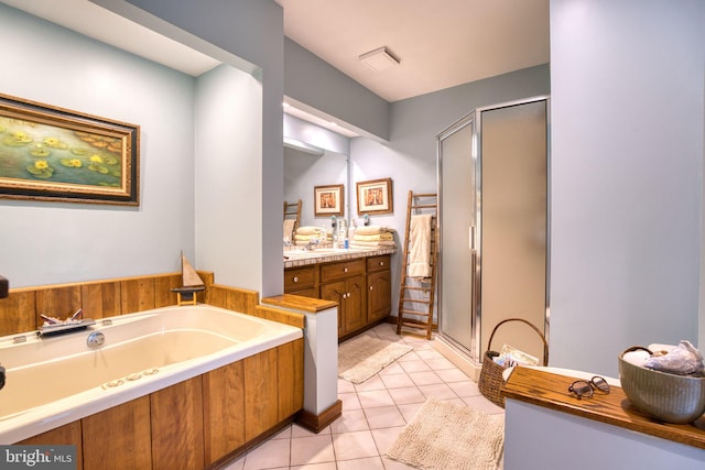 3012 Duncan Rd, White Hall, MD 21161 - full bathroom featuring a stall shower, tile patterned flooring, a garden tub, and vanity