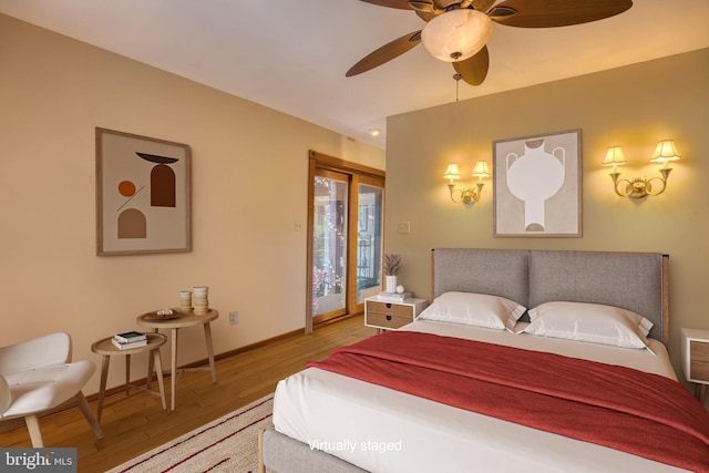 3012 Duncan Rd, White Hall, MD 21161 - bedroom featuring access to exterior, wood finished floors, baseboards, and a ceiling fan