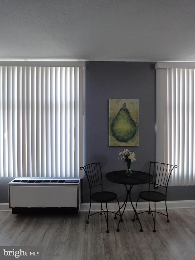 dining area featuring wood finished floors and plenty of natural light