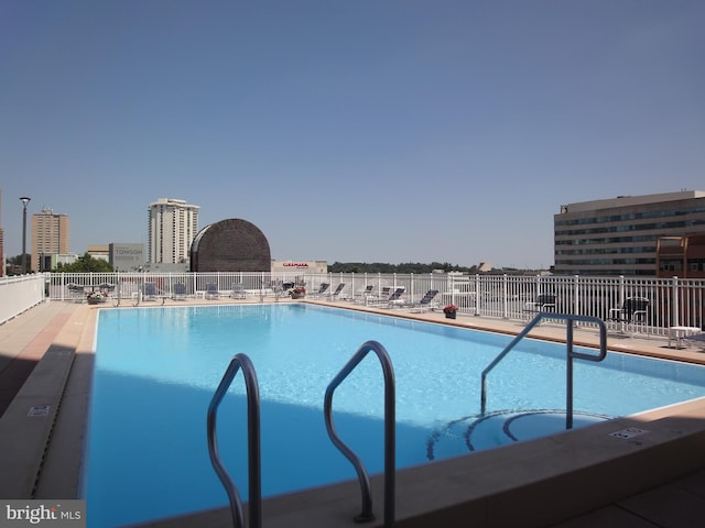 community pool featuring fence