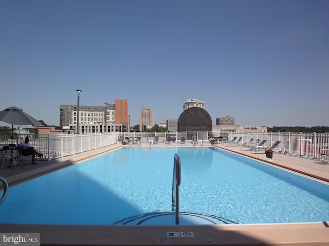 community pool featuring fence