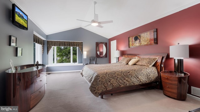 bedroom featuring carpet floors, ornamental molding, baseboards, vaulted ceiling, and a ceiling fan