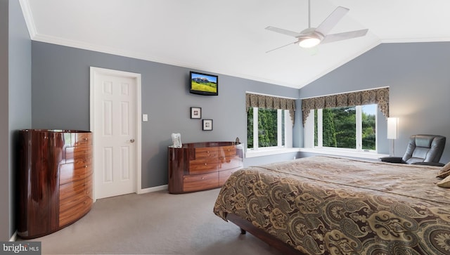 carpeted bedroom featuring crown molding, lofted ceiling, a ceiling fan, and baseboards