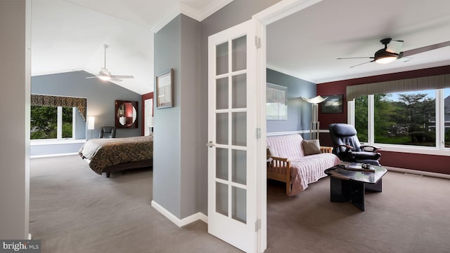 carpeted bedroom featuring multiple windows, ornamental molding, baseboards, french doors, and vaulted ceiling