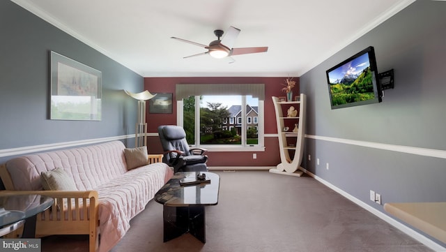 living area featuring ornamental molding, carpet, ceiling fan, and baseboards