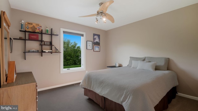 bedroom with baseboards, carpet floors, and ceiling fan