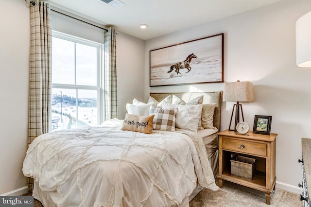carpeted bedroom with baseboards