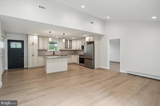 119 Oaktree Dr, Levittown, PA 19055 - kitchen featuring stainless steel appliances, recessed lighting, decorative backsplash, glass insert cabinets, and a kitchen island