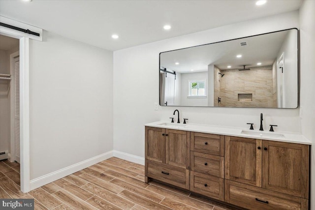 119 Oaktree Dr, Levittown, PA 19055 - full bathroom featuring wood tiled floors, double vanity, a shower, baseboards, and recessed lighting