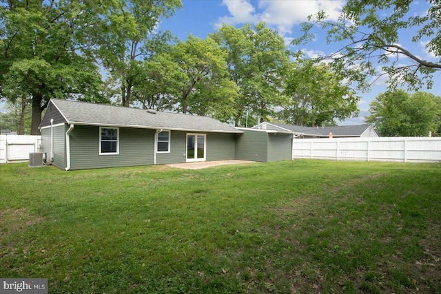 119 Oaktree Dr, Levittown, PA 19055 - rear view of property with central AC, a patio area, and roof with shingles