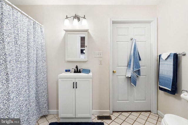 717 E Greenman Rd, Haddonfield, NJ 08033 - bathroom featuring tile patterned floors, baseboards, vanity, and toilet