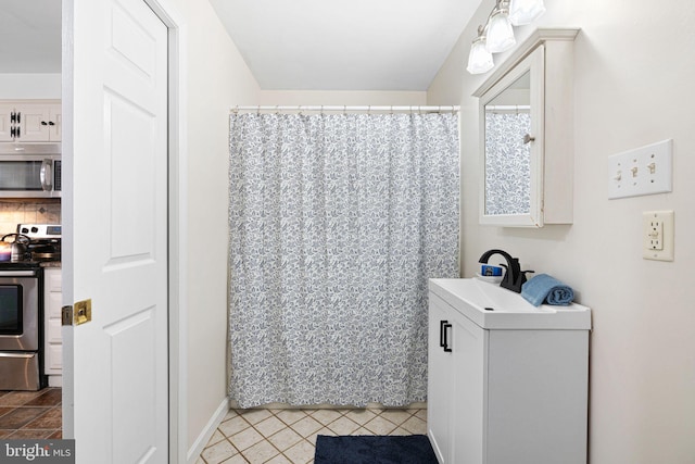 717 E Greenman Rd, Haddonfield, NJ 08033 - full bath with a sink, baseboards, and a shower with shower curtain