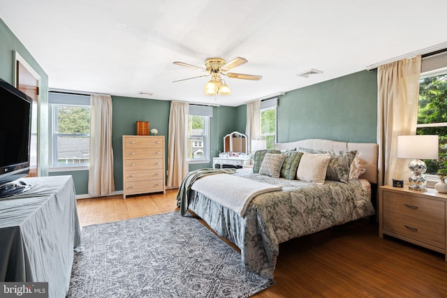 717 E Greenman Rd, Haddonfield, NJ 08033 - bedroom featuring wood finished floors, multiple windows, and a ceiling fan