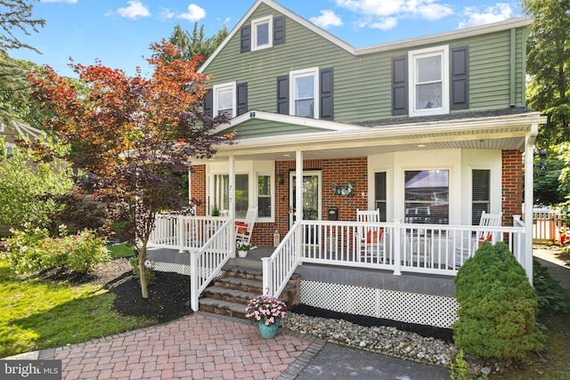 717 E Greenman Rd, Haddonfield, NJ 08033 - view of front of house featuring brick siding and covered porch