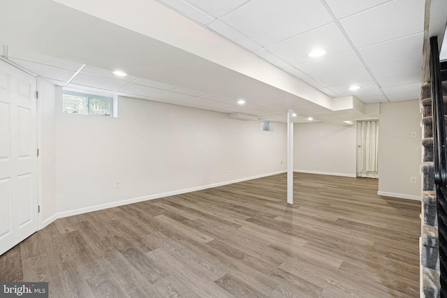 717 E Greenman Rd, Haddonfield, NJ 08033 - below grade area featuring a drop ceiling, wood finished floors, baseboards, and recessed lighting