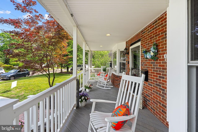 717 E Greenman Rd, Haddonfield, NJ 08033 - wooden porch featuring a lawn