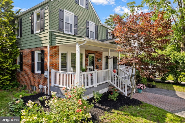 717 E Greenman Rd, Haddonfield, NJ 08033 - view of front of property with a porch and brick siding