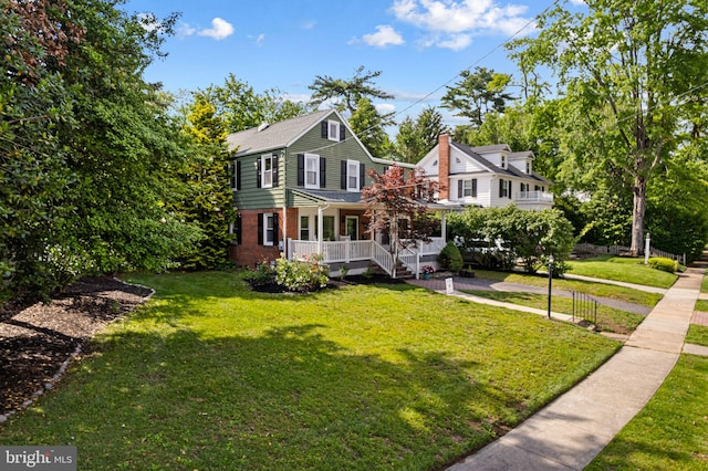 717 E Greenman Rd, Haddonfield, NJ 08033 - view of front facade with covered porch, brick siding, and a front yard