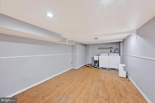 1407 Clarkson St, Baltimore, MD 21230 - finished basement featuring wood finished floors, independent washer and dryer, and baseboards