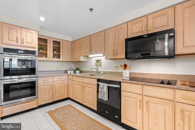 930 Astern Way Unit 502, Annapolis, MD 21401 - kitchen featuring black appliances, light brown cabinetry, and a sink