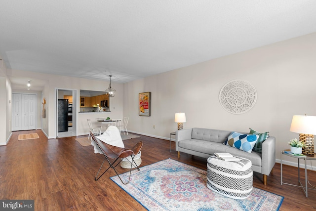 930 Astern Way Unit 502, Annapolis, MD 21401 - living area with dark wood-style floors and baseboards
