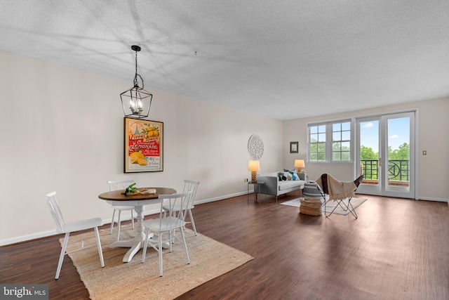 930 Astern Way Unit 502, Annapolis, MD 21401 - dining area featuring dark wood finished floors, a textured ceiling, a chandelier, and baseboards