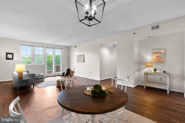930 Astern Way Unit 502, Annapolis, MD 21401 - dining space featuring wood finished floors, baseboards, a chandelier, and a textured ceiling