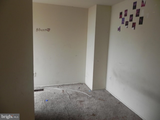 empty room with carpet flooring